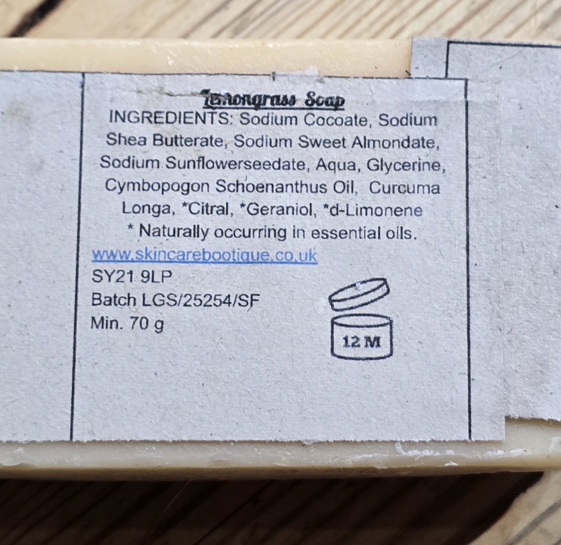 Bar of skincareBOOtique Lemongrass soap with a label showing ingredients and branding details.