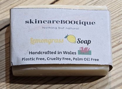 Bar of natural Lemongrass soap with 'skincareBOOtique' packaging on a wooden surface