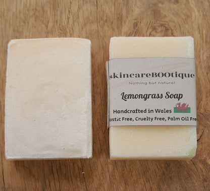 Two bars of skincareBOOtique lemongrass soap with packaging that reads 'Lemongrass Soap', stating the product is handcrafted in Wales, plastic free, cruelty free, and palm oil free.